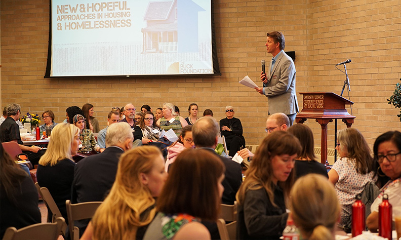 man speaking to audience