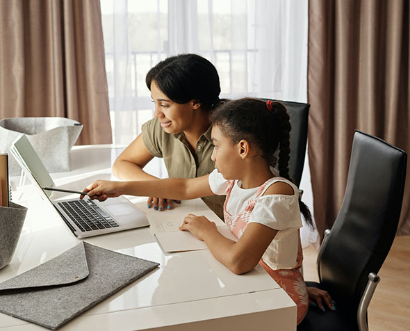 mother and daughter using a computer