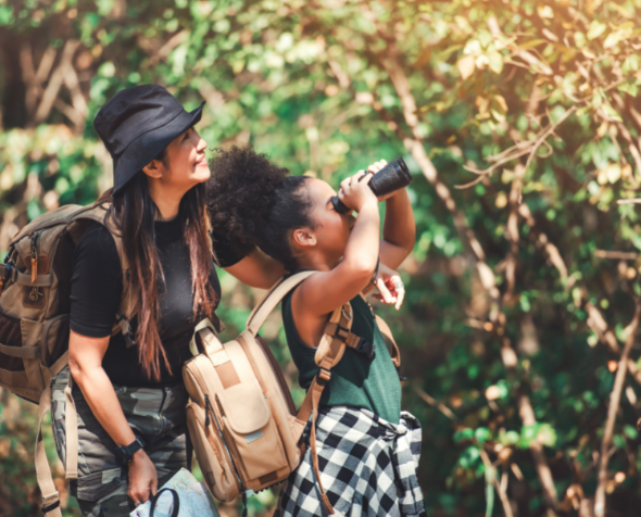 Woman and girl exploring nature