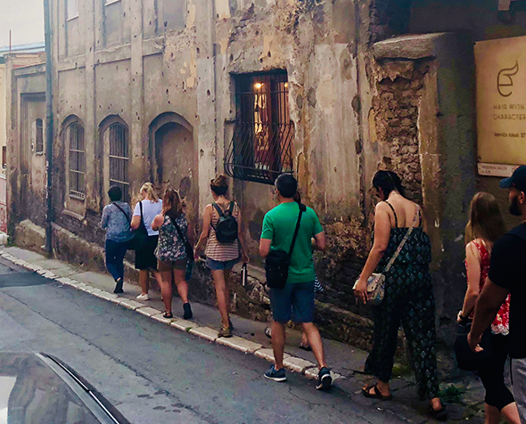 line of people walking down a street