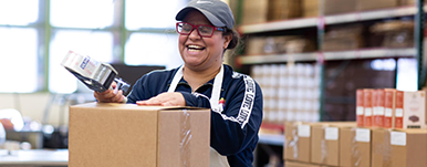 woman packaging a box
