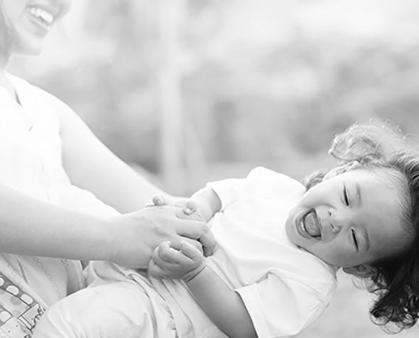 person holding child black and white