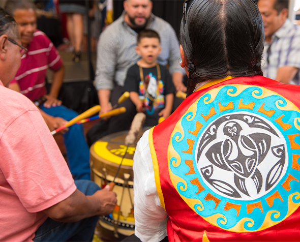 Snippet image of indigenous group playing drums