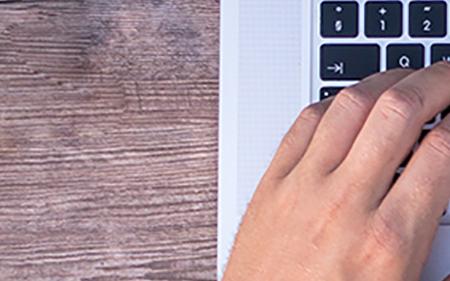 Hands typing on keyboard