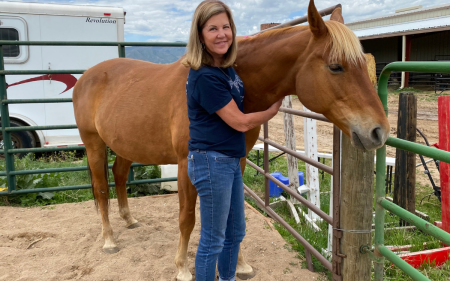 Floerke standing next to a horse