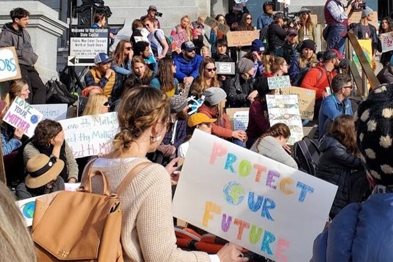 Activists at the 2020 Winter Outdoor Retailer Show climate strike demanding climate action now