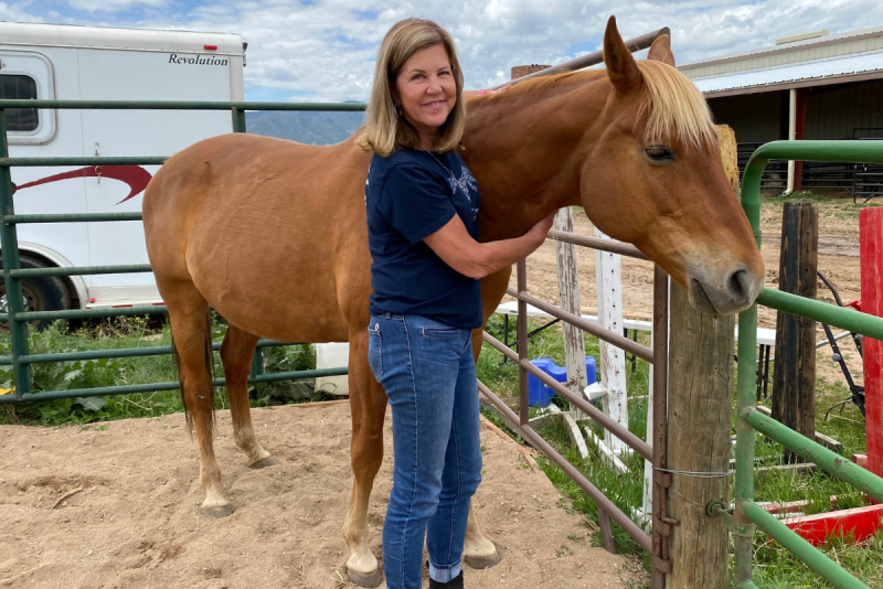 Floerke standing next to a horse