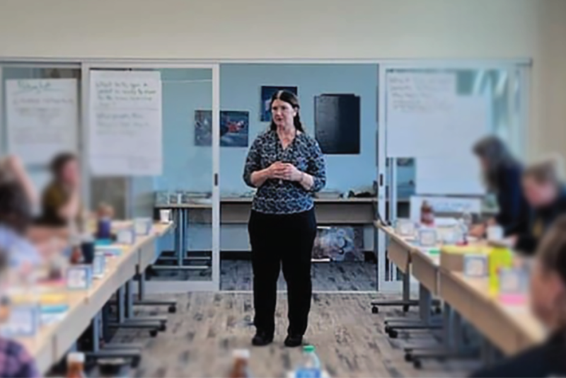 Woman named Carole Wilcox speaking to group of people