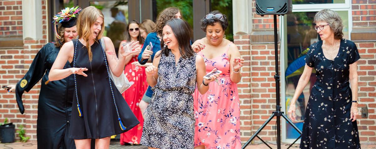 GSSW community dancing and laughing at the Open House Event