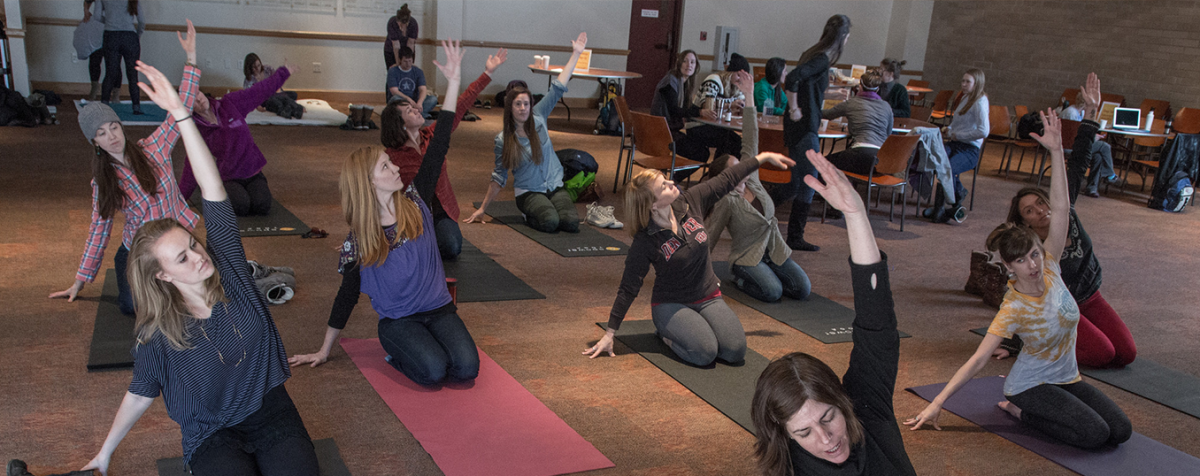 students doing yoga