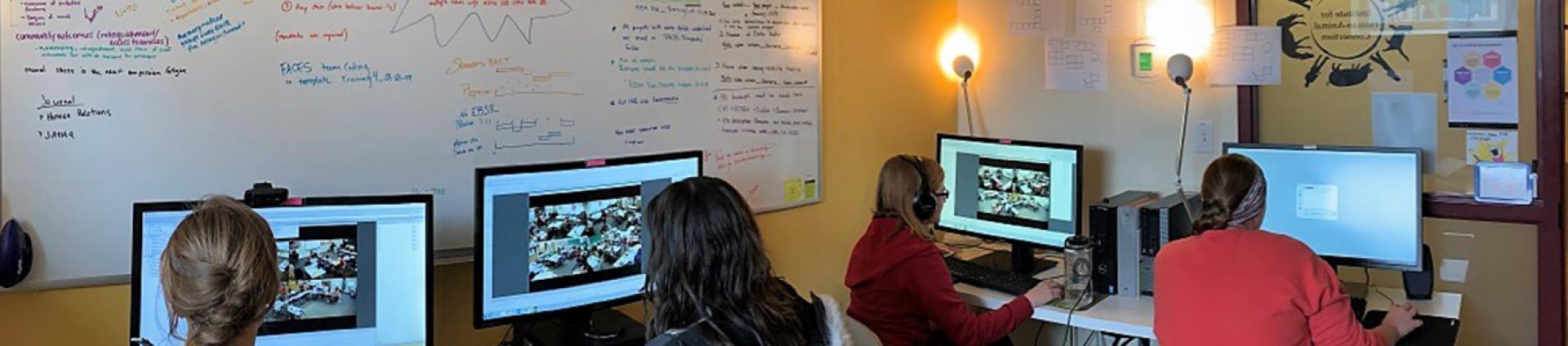 IHAC Graduate Research Assistants on Computers