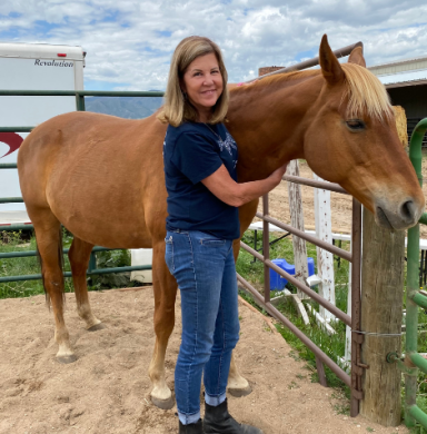 Floerke standing next to a horse