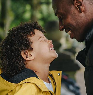 Smiling adult and child